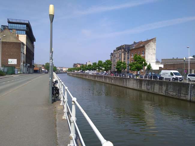 Although some tree cover is visible, it remains sparse and disconnected from the water and several sections of the canal area are devoid of natural areas altogether.